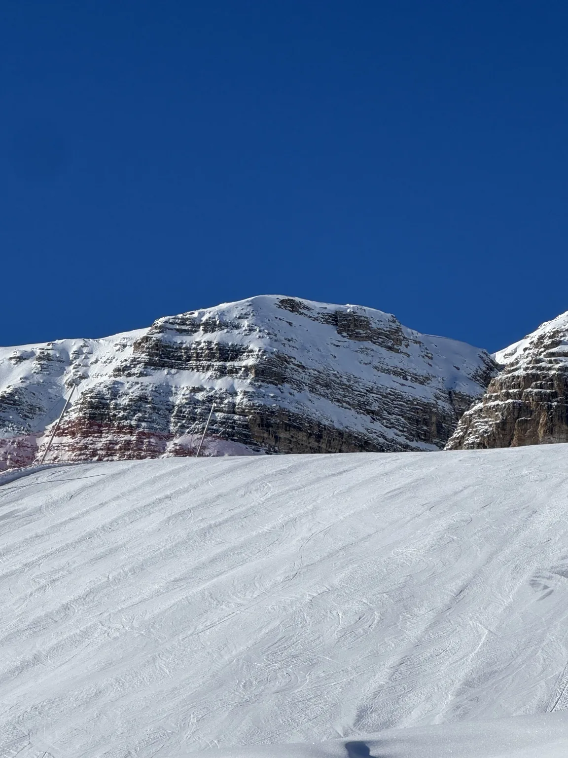 Wide slopes and Dolomite rock walls.
